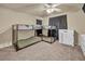 Bedroom with bunk beds, a ceiling fan, and carpeted floors at 9431 Mad Dog St, Las Vegas, NV 89178