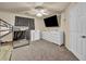 Bedroom featuring bunk beds, a ceiling fan, carpeted floors, and a tv at 9431 Mad Dog St, Las Vegas, NV 89178