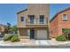 Charming two-story home featuring a private balcony and a one-car garage at 9431 Mad Dog St, Las Vegas, NV 89178
