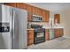 Well-lit kitchen showcasing stainless steel appliances and ample cabinet space at 9431 Mad Dog St, Las Vegas, NV 89178