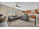 Open floorplan living room featuring sofas and access to the kitchen at 9431 Mad Dog St, Las Vegas, NV 89178