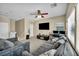 Cozy upstairs living room featuring comfortable couches and a TV at 9431 Mad Dog St, Las Vegas, NV 89178