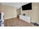 Open living area with hard wood flooring and light colored walls at 9431 Mad Dog St, Las Vegas, NV 89178