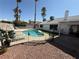 Fenced backyard features a sparkling pool, mature palms, and low-maintenance landscaping for outdoor enjoyment at , Las Vegas, NV 89110