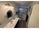 Well-lit bathroom with modern lighting fixtures and a glass shower stall at , Las Vegas, NV 89110
