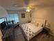 Cozy bedroom with wood-look floors, a ceiling fan, and natural lighting at , Las Vegas, NV 89110