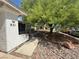 Exterior of the property showing the number, landscaping, and access to a front screened in patio area at , Las Vegas, NV 89110