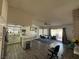 An open-concept kitchen and dining area with granite countertops, stainless steel appliances and natural light at , Las Vegas, NV 89110