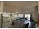 Open kitchen and dining area featuring an island with granite countertop and a sliding door to the backyard at , Las Vegas, NV 89110