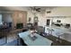 Spacious, open living area features a brick fireplace, modern kitchen, and cozy dining space at , Las Vegas, NV 89110