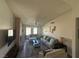 Spacious living room with a brick fireplace, large windows, and comfortable seating arrangements at , Las Vegas, NV 89110