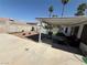 Enjoy outdoor dining on this covered patio overlooking a well-maintained backyard with a sparkling pool at , Las Vegas, NV 89110
