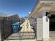 Wrought iron gated side yard features a secure entrance and practical waste container storage at , Las Vegas, NV 89110