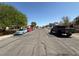 Residential street featuring a variety of parked cars under a clear sky at , Las Vegas, NV 89110