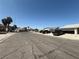 Quiet neighborhood street with well-maintained homes and mature landscaping at , Las Vegas, NV 89110