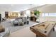 Spacious finished basement is virtually staged with a pool table, bar, and living area at 1 Ibis Ct, Henderson, NV 89052