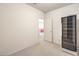Bright flex room featuring neutral carpet, access to other living areas, and a wine refrigerator at 1 Ibis Ct, Henderson, NV 89052
