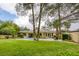 Expansive backyard with lush landscaping, pool, and outdoor seating at 10156 Kearney Hill Pl, Las Vegas, NV 89144