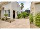 Exterior shot of home's outdoor area featuring desert landscaping and an entrance to what appears to be a gym at 10156 Kearney Hill Pl, Las Vegas, NV 89144