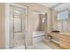 This bathroom showcases a glass-enclosed shower, a soaking tub, and a vanity with generous counter space at 10156 Kearney Hill Pl, Las Vegas, NV 89144