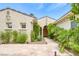 Inviting front entrance featuring stone pathway, desert landscaping and a covered entryway at 10156 Kearney Hill Pl, Las Vegas, NV 89144
