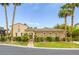 Elegant single-story home featuring lush landscaping, a gated entrance and desert-friendly design at 10156 Kearney Hill Pl, Las Vegas, NV 89144