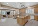 Modern kitchen with a central island and open layout to the breakfast nook and living spaces at 10156 Kearney Hill Pl, Las Vegas, NV 89144