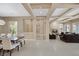 Expansive living area with fireplace, coffered ceilings and open layout to dining and living spaces at 10156 Kearney Hill Pl, Las Vegas, NV 89144