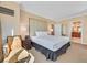Cozy bedroom with a bed, chair, and nightstand at 135 E Harmon Ave # 2301, Las Vegas, NV 89109