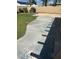 Large concrete patio with green grass and privacy fence offers outdoor space perfect for relaxation at 1742 Ashburn Dr, North Las Vegas, NV 89032