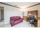 Bedroom includes a sofa, desk, and chair, providing a comfortable and functional workspace at 1742 Ashburn Dr, North Las Vegas, NV 89032