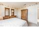 Bright bedroom with a wooden dresser and wardrobe, providing ample storage space at 1742 Ashburn Dr, North Las Vegas, NV 89032