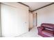 Bright bedroom featuring a built-in closet and a comfortable seating area, perfect for relaxation at 1742 Ashburn Dr, North Las Vegas, NV 89032
