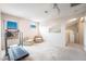 Bright bonus room featuring neutral carpet, natural light, and comfortable seating at 1742 Ashburn Dr, North Las Vegas, NV 89032