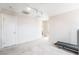 Spacious bonus room with carpet flooring, a door for privacy, and natural light at 1742 Ashburn Dr, North Las Vegas, NV 89032