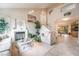 Bright living room with a fireplace, high ceilings, and stairs leading to the second floor at 1742 Ashburn Dr, North Las Vegas, NV 89032