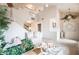 Bright living room with a staircase and high ceilings, creating an open and airy atmosphere at 1742 Ashburn Dr, North Las Vegas, NV 89032