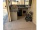Covered outdoor kitchen includes built-in grill, sink, and storage, perfect for entertaining outside at 1742 Ashburn Dr, North Las Vegas, NV 89032