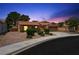 Charming single-story home featuring a tile roof, attached garage, and desert landscaping for easy maintenance at 1929 Stonington Pl, Las Vegas, NV 89108
