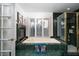 Relaxing bathroom features a soaking tub, plantation shutters, and glass shower at 2108 Inverness Dr, Henderson, NV 89074