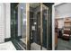 Modern bathroom features a glass shower with a gold frame and convenient shelving at 2108 Inverness Dr, Henderson, NV 89074