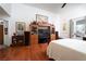 Spacious bedroom is well-lit and features wood floors, a TV, and outdoor access at 2108 Inverness Dr, Henderson, NV 89074