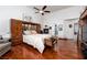 Bright bedroom boasts wood floors, vaulted ceilings, and a cozy fireplace at 2108 Inverness Dr, Henderson, NV 89074