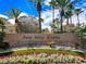 Elegant Palm Valley Estates community sign with lush landscaping, artificial turf, and vibrant flowerbeds at 2108 Inverness Dr, Henderson, NV 89074