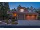 Charming home featuring a two-car garage, desert landscaping, and a covered front porch at 2108 Inverness Dr, Henderson, NV 89074