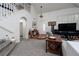Welcoming foyer with a high ceiling, arched doorway, marble floor, and staircase at 2108 Inverness Dr, Henderson, NV 89074