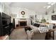 Bright and airy living room featuring a fireplace, skylights, and comfortable seating at 2108 Inverness Dr, Henderson, NV 89074