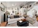 Bright living room with a vaulted ceiling, skylights, and a staircase leading to the second floor at 2108 Inverness Dr, Henderson, NV 89074