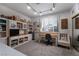 Bright office space with custom shelving, storage, and a large window at 2108 Inverness Dr, Henderson, NV 89074