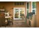 Outdoor kitchen area featuring a built-in grill, storage, and a cozy dining setup at 2108 Inverness Dr, Henderson, NV 89074